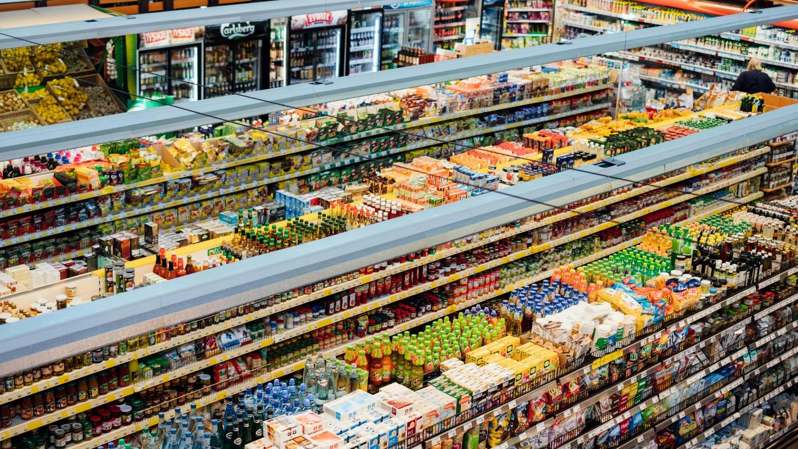 Aerial view of Gatlinburg grocery stores, with aisles filled with colorful packaged food and drink products, including beverages, snacks, and groceries, all neatly organized on shelves.