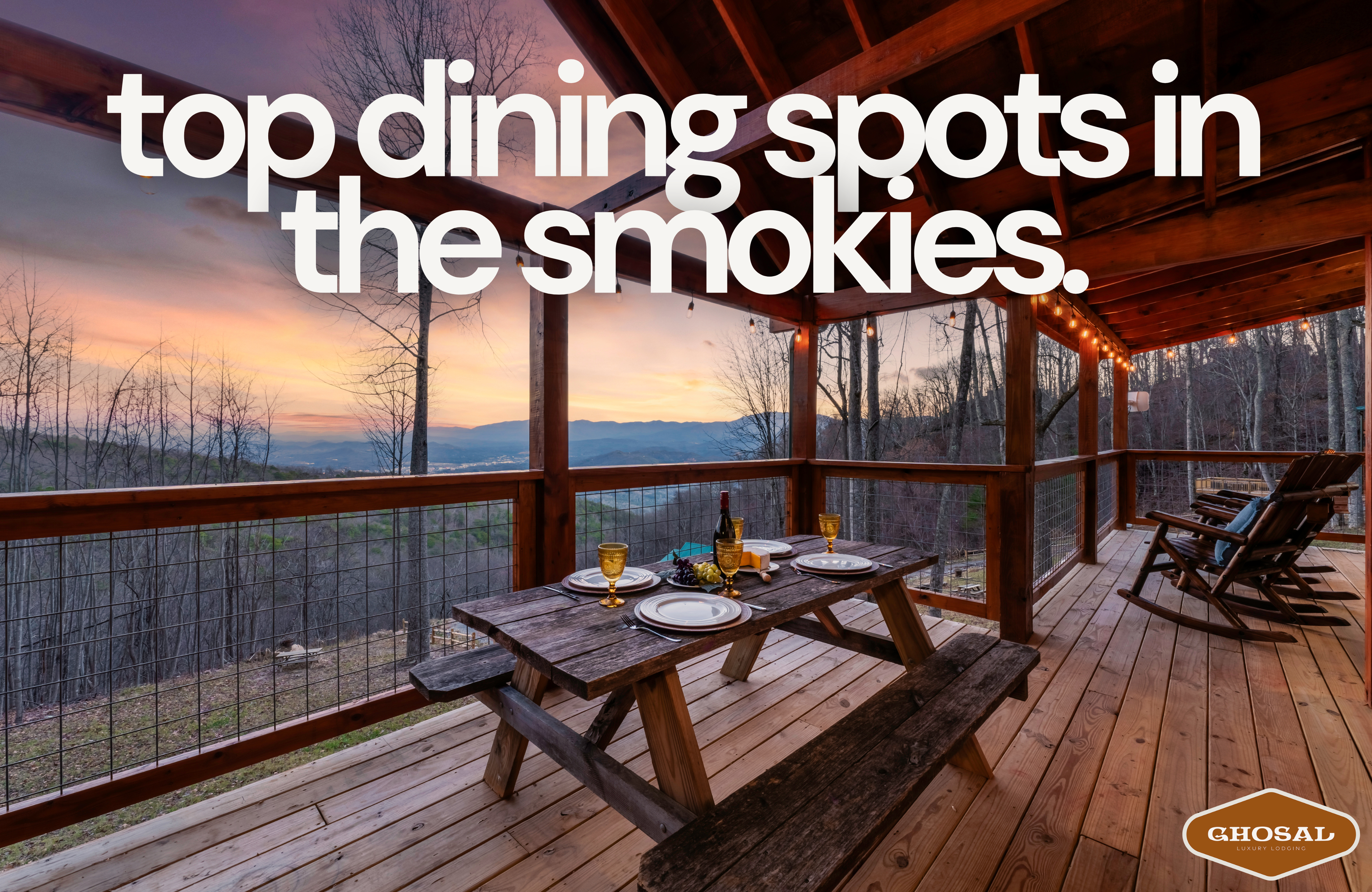 A wooden picnic table set for dinner sits on a covered deck overlooking mountains at sunset, with text reading top restaurants Smoky Mountains. The cozy, rustic scene offers scenic views and highlights must-visit Smokies dining spots.