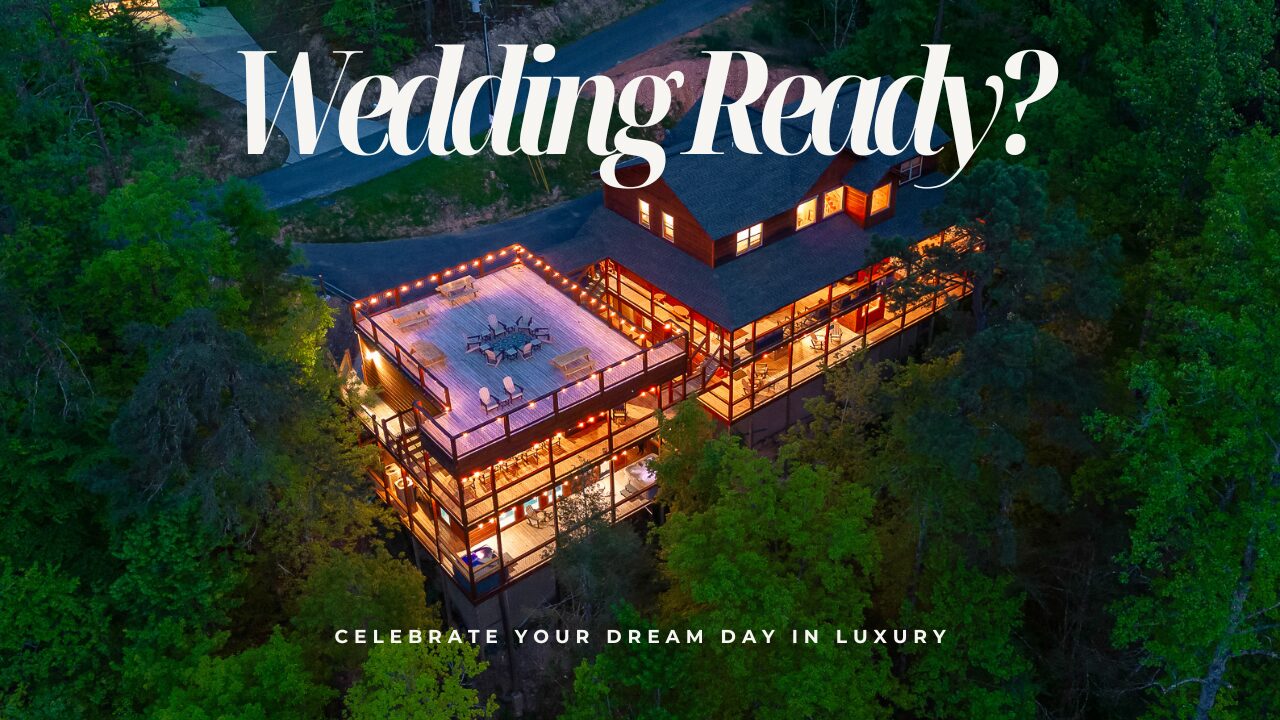 Aerial view of a large, well-lit cabin surrounded by trees at dusk with text overlay: Wedding Ready? Discover one of the top wedding venues and celebrate your dream day in luxury.