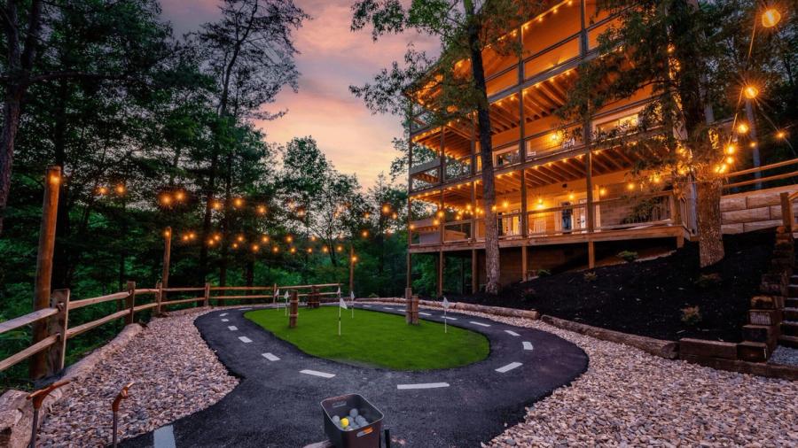 View of the outside area of the apartment. Has a small paved racetrack.
