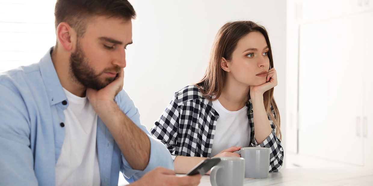 A couple in a tense moment, showing signs of uncertainty in love.