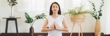 A woman meditating in a light space