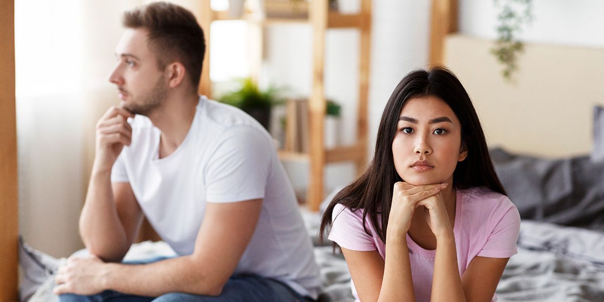 Young couple in conflict pondering their relationship's future.