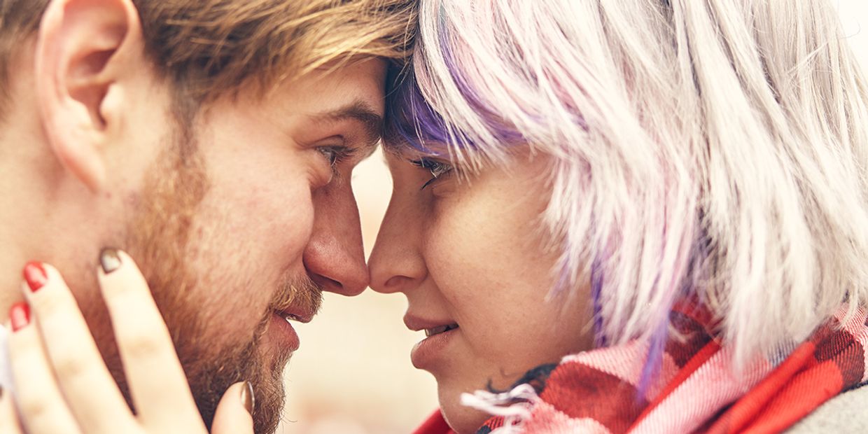 Close-up of a couple contemplating their relationship future, looking into each others eyes in a loving way.