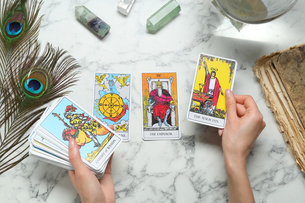 A lady showing her Tarot cards