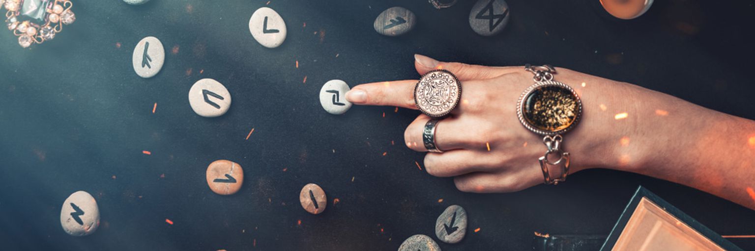 A woman casting runestones