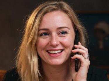 A female psychic reader doing a psychic reading on the phone