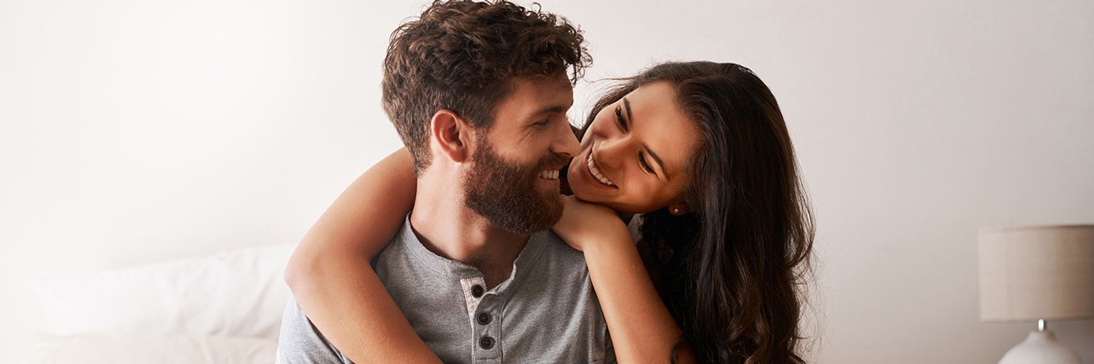 A couple in love, hugging each other.