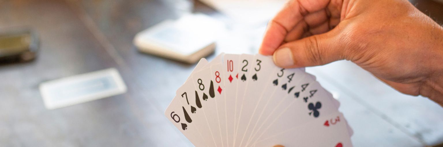 A woman showing a card spread