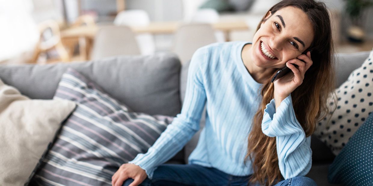 How Trusted Psychics Can Help You Find the Love You Deserve - A young woman on the phone.