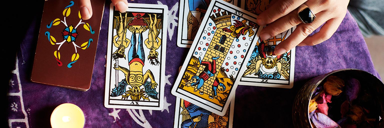 A lady performing a tarot reading