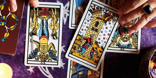 A lady performing a tarot reading