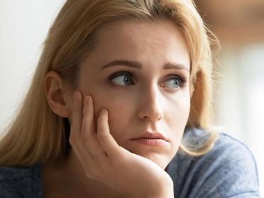 Woman contemplating her relationship: Does he love me?