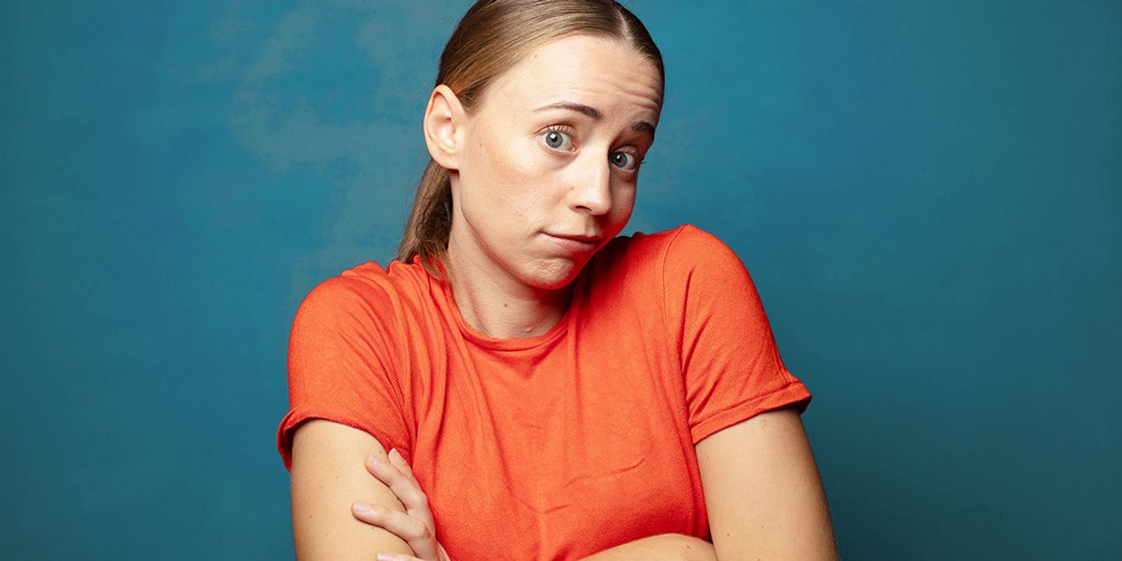 A woman contemplating her options for psychic readings in the UK.