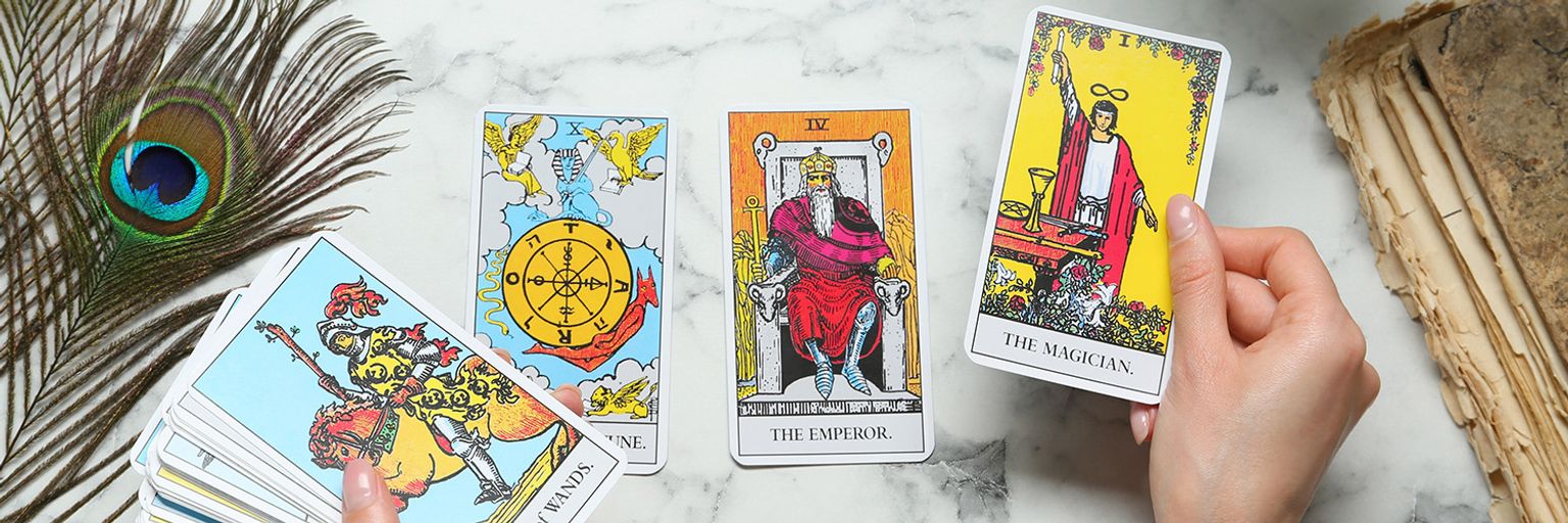 A woman holding tarot cards
