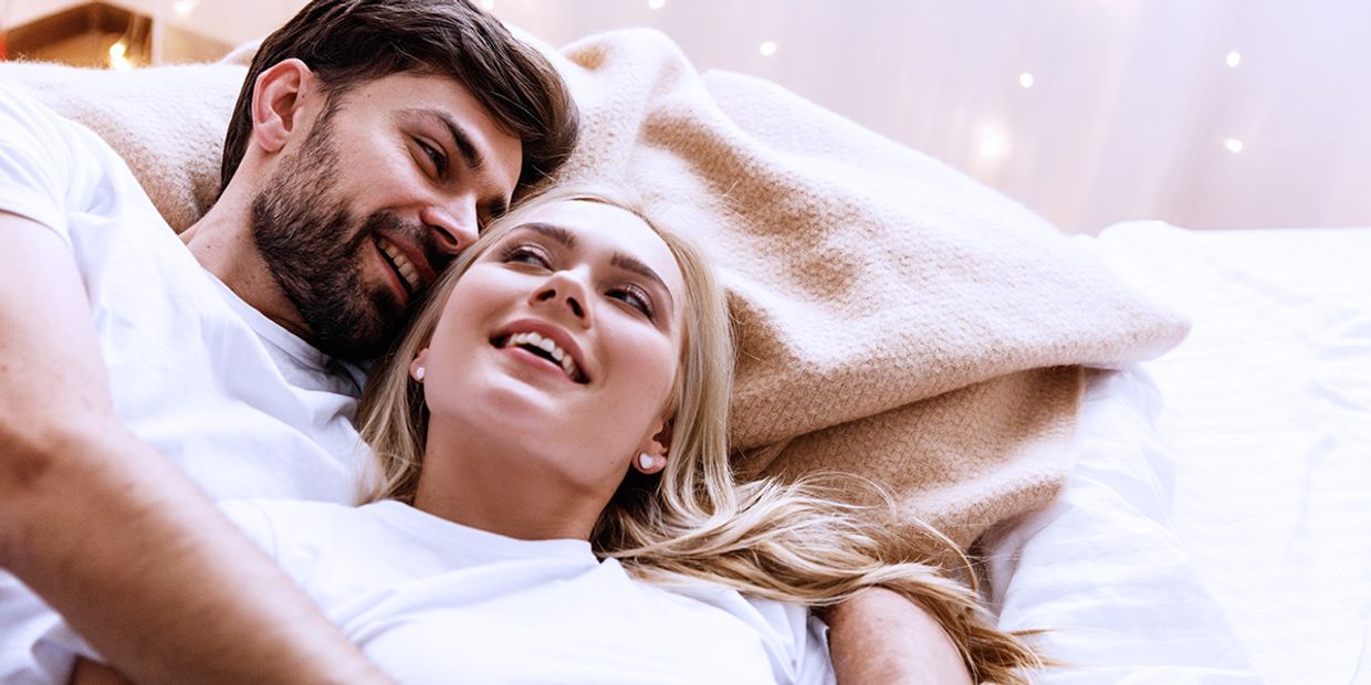 Couple enjoying intimate moments, embodying love and connection after receiving relationship guidance.