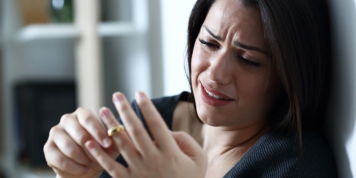 A woman reflects on her past love, taking off her wedding ring, seeking psychic guidance about her ex.