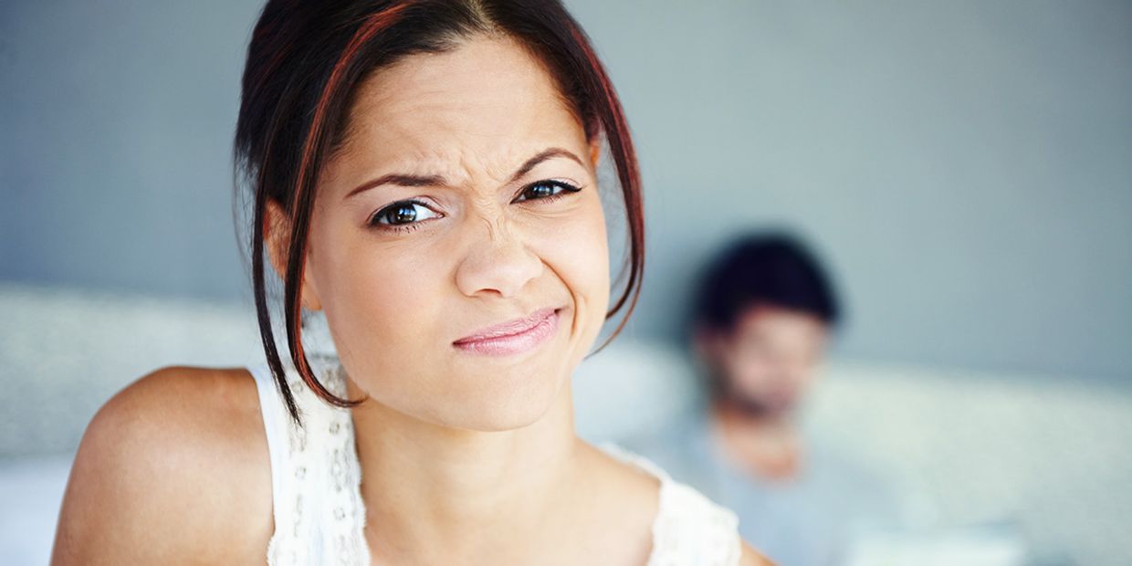 Woman contemplating the best psychic reading services in the UK, discussing options.