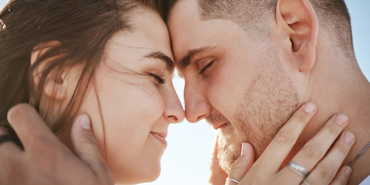 A couple in love, embracing each other.