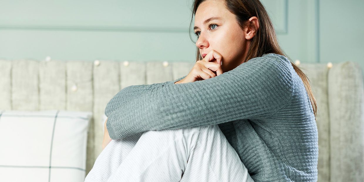 A young woman who looks like she is lonely and has no one to speak with.