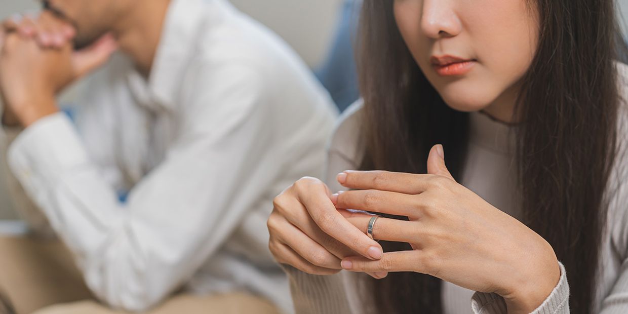 Woman showing signs of distress, indicating cheating suspicions.