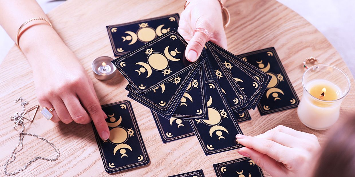 A Tarot reader conducting a tarot reading.