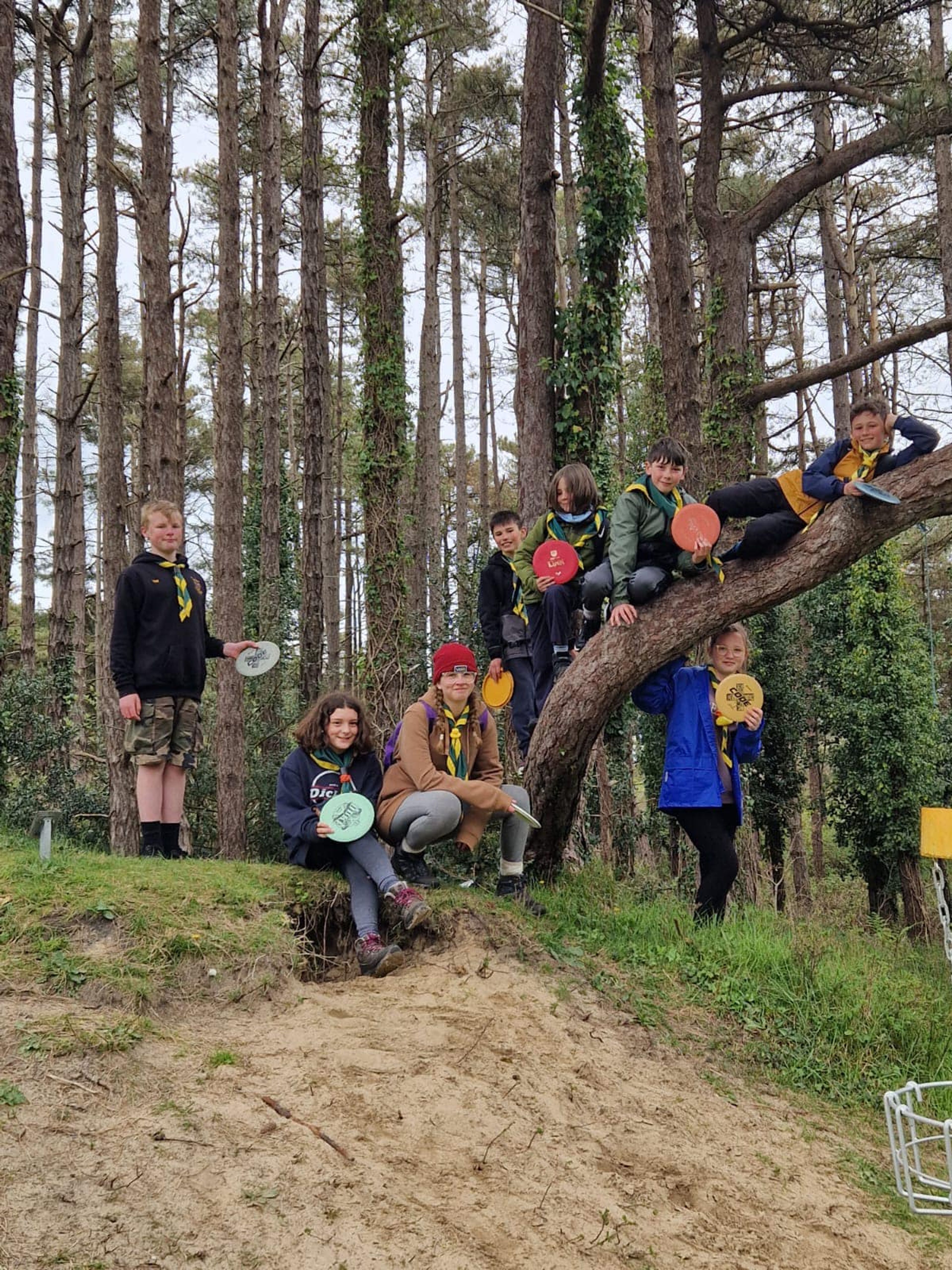 Members of 1st Kidwelly Scouts climbing a tree