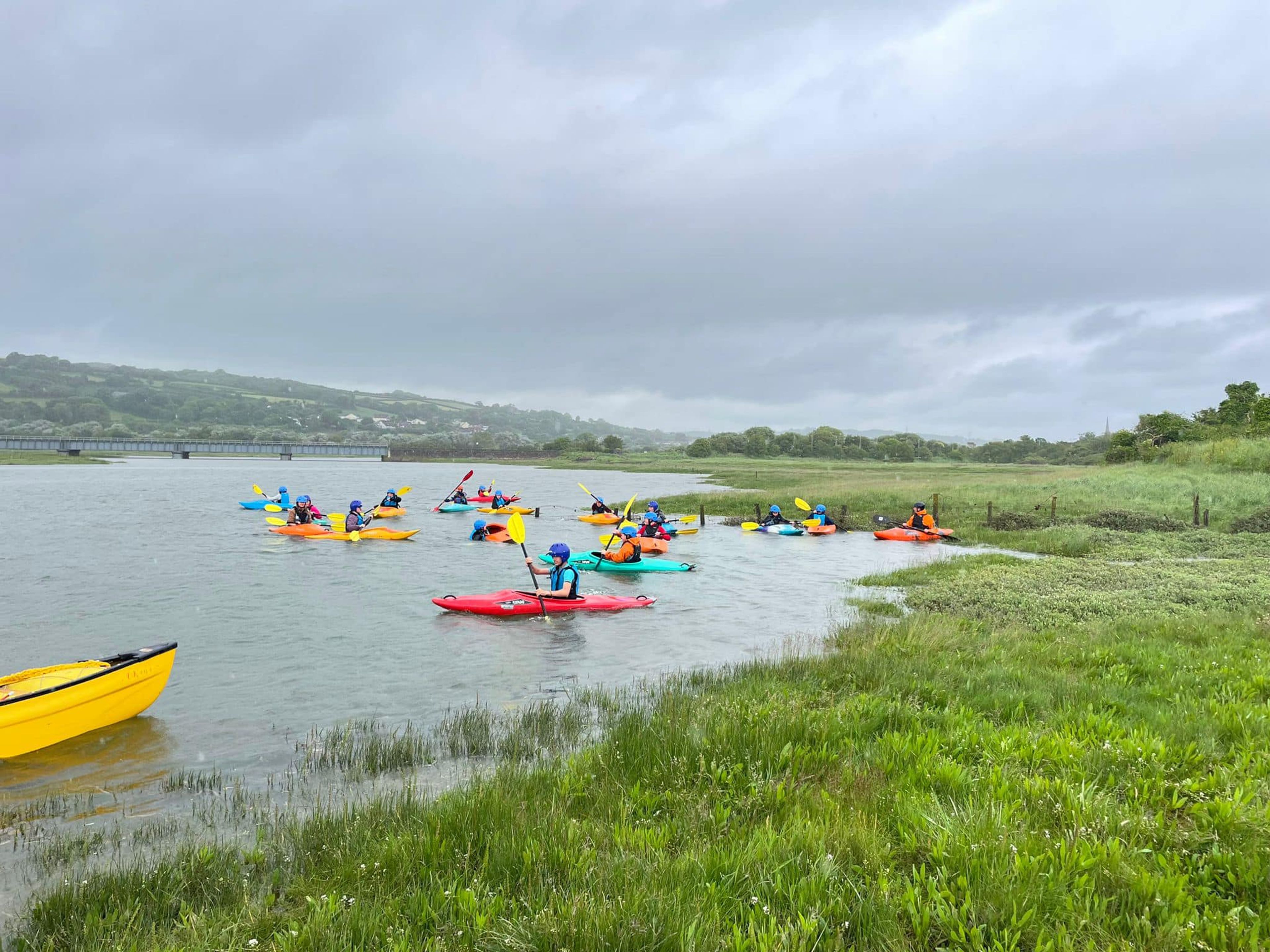 Members of 1st Kidwelly Scouts kayaking in a river