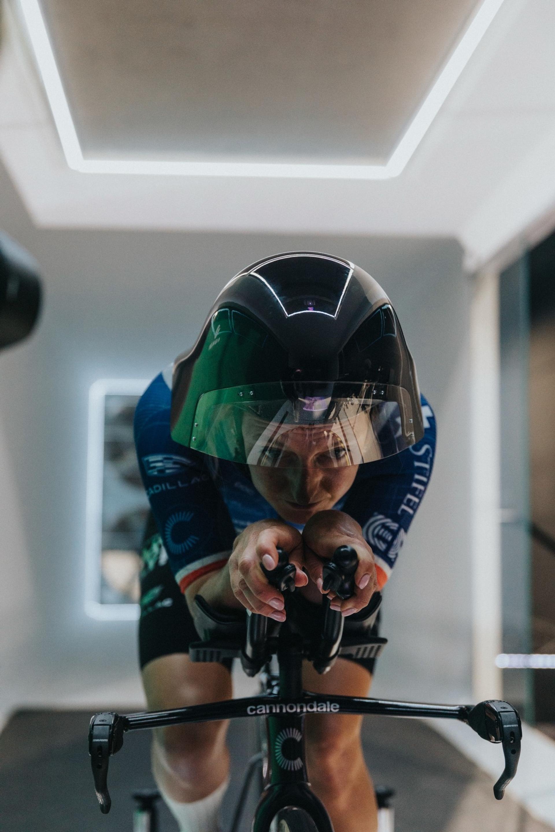 Cyclist wearing a POC Sonal time-trial helmet rides a Cannondale bike in an aerodynamic position