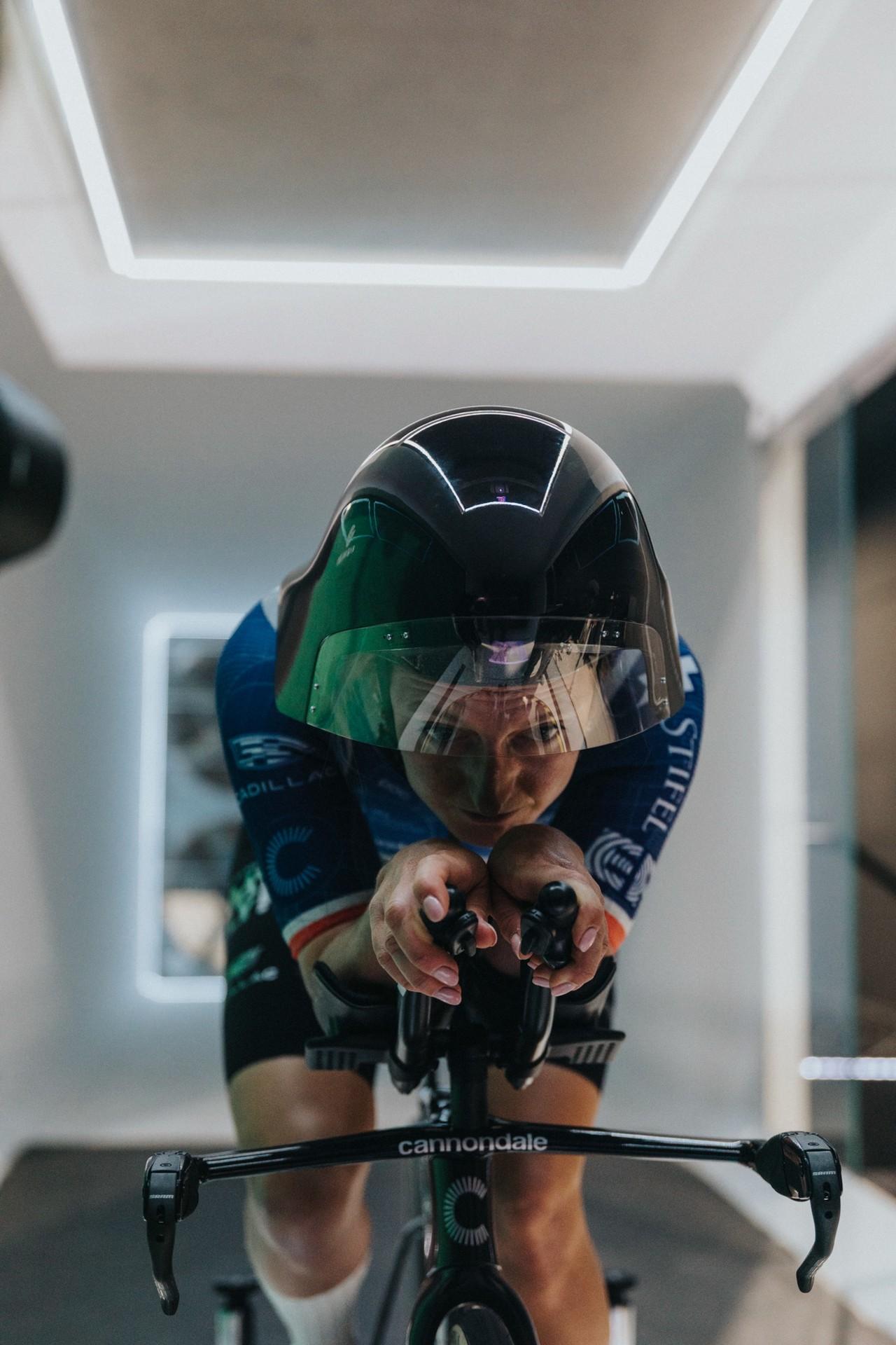 Cyclist wearing a POC Sonal time-trial helmet rides a Cannondale bike in an aerodynamic position