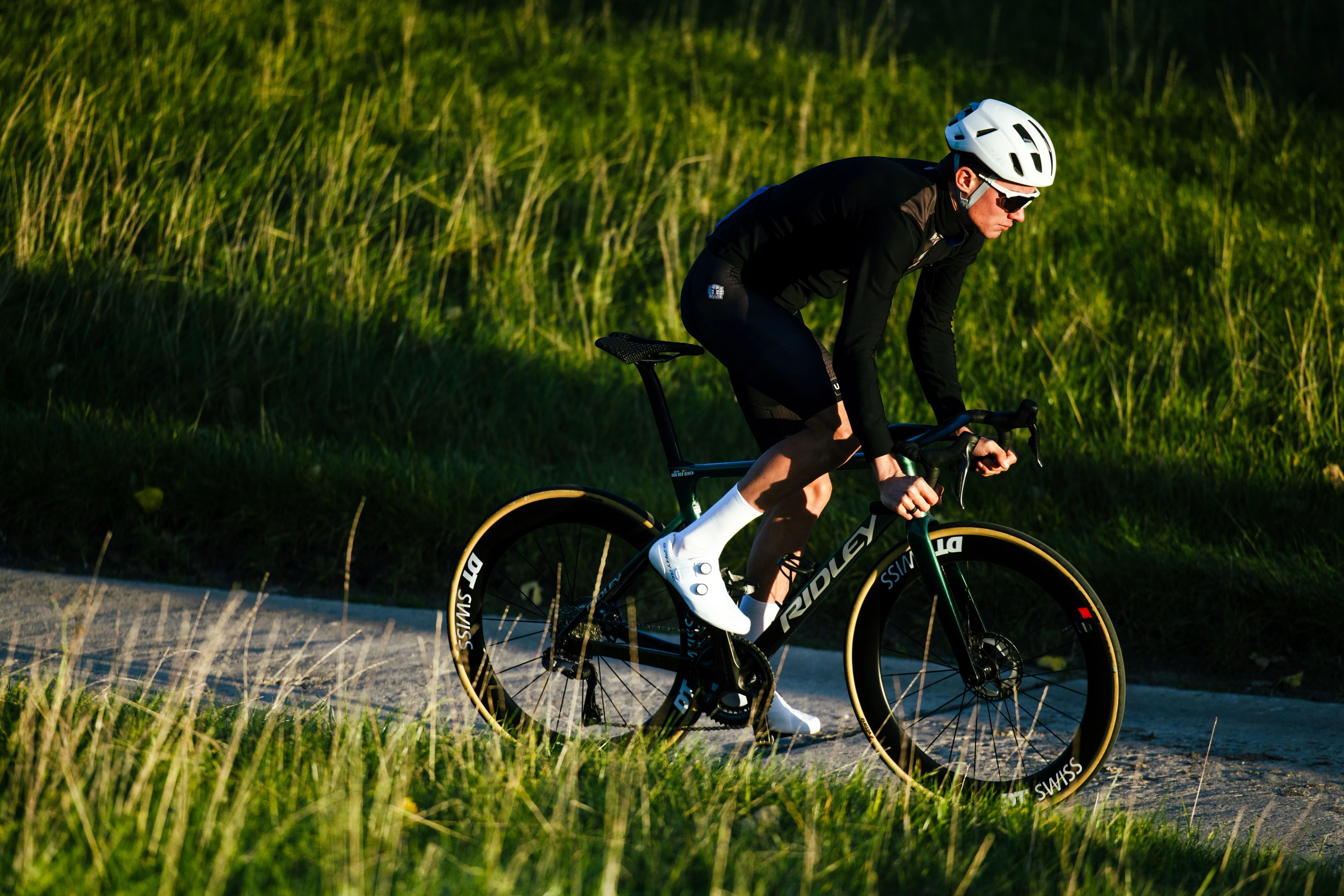 Man cycling in Lazer Sphere KinetiCore helmet