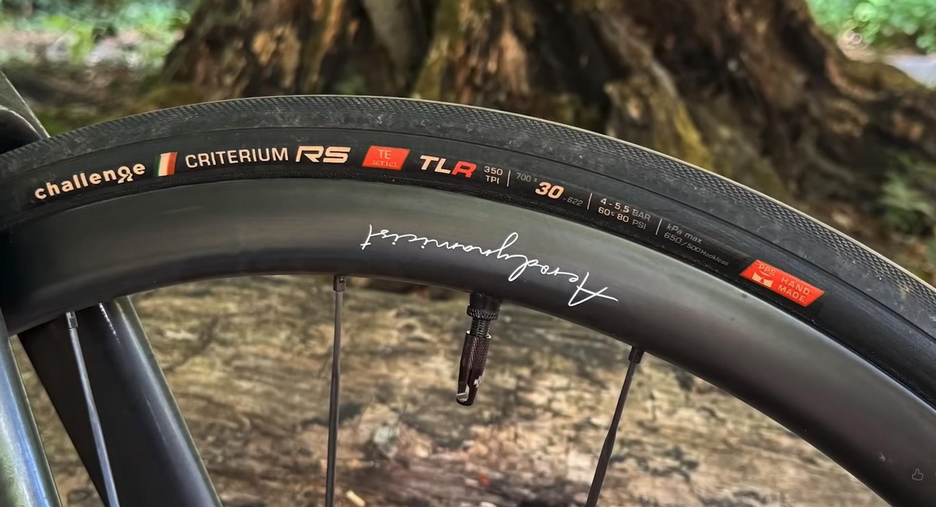 Close-up of a Challenge Criterium RS tire mounted on an Aerodynamicist carbon road bike rim.