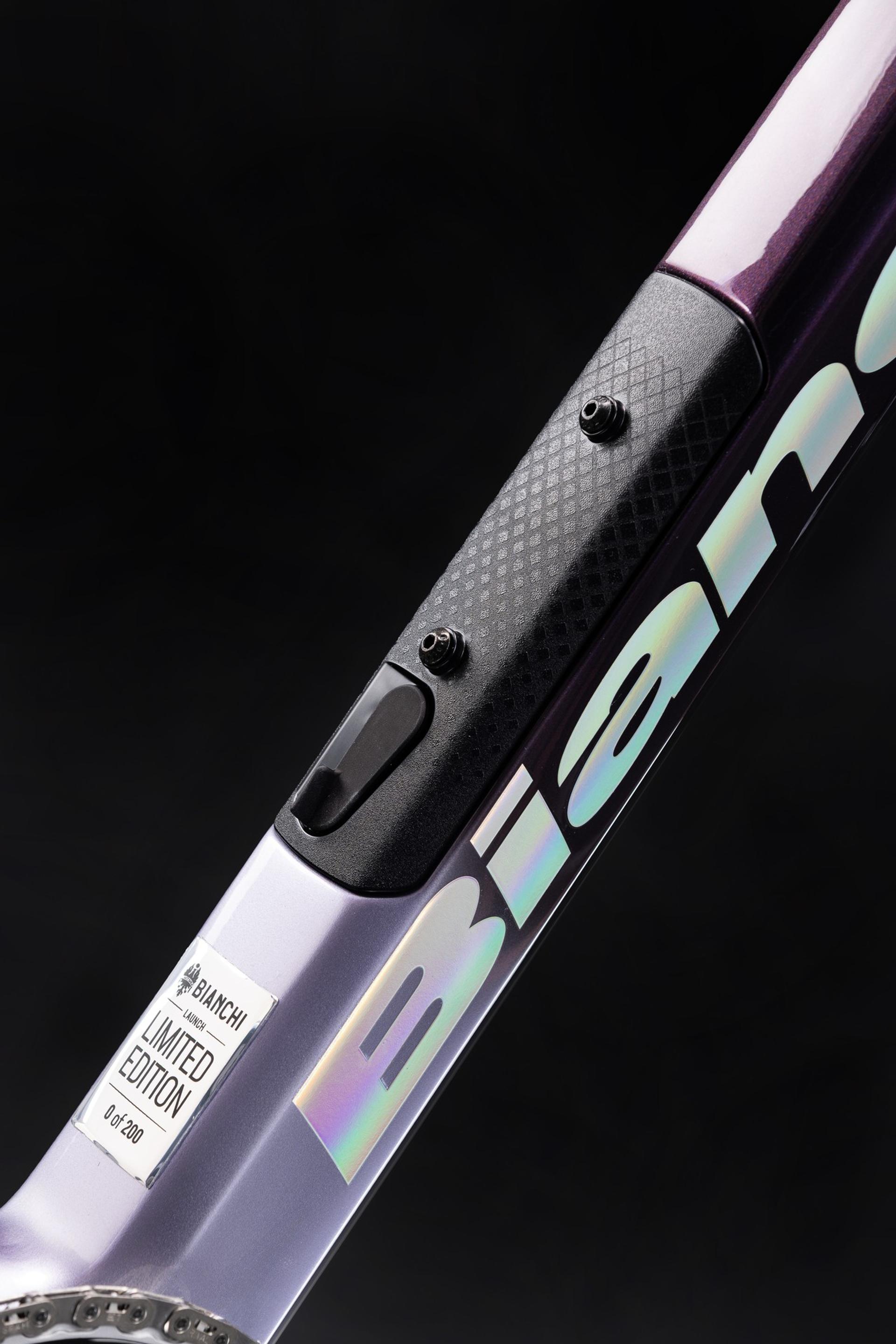 Close-up of the integrated carbon storage hatch on a limited edition Bianchi Infinito road bike frame.