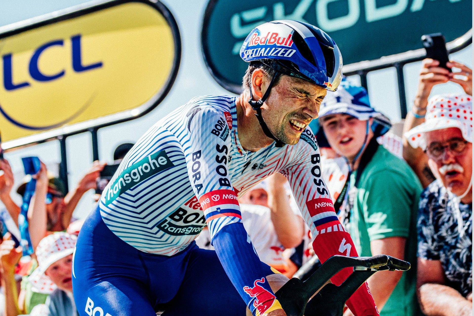Primoz Roglic strains over his handlebars during the Tour de France stage 13 time trial.
