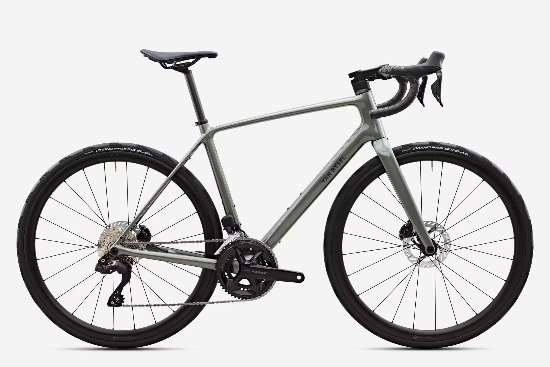 Studio photo of a road racing bicycle with drop handlebars, disc brakes, and carbon frame