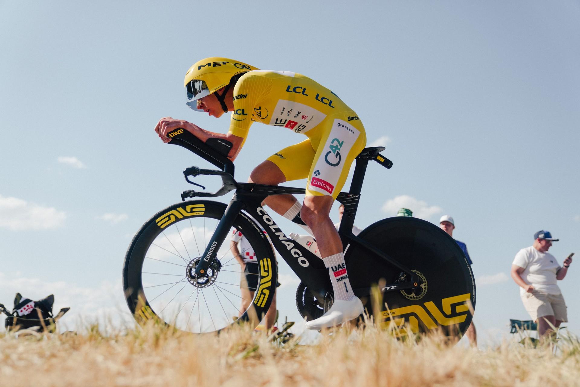 Tadej Pogačar in yellow attacks during Tour de France 2026 individual time trial on a road verge
