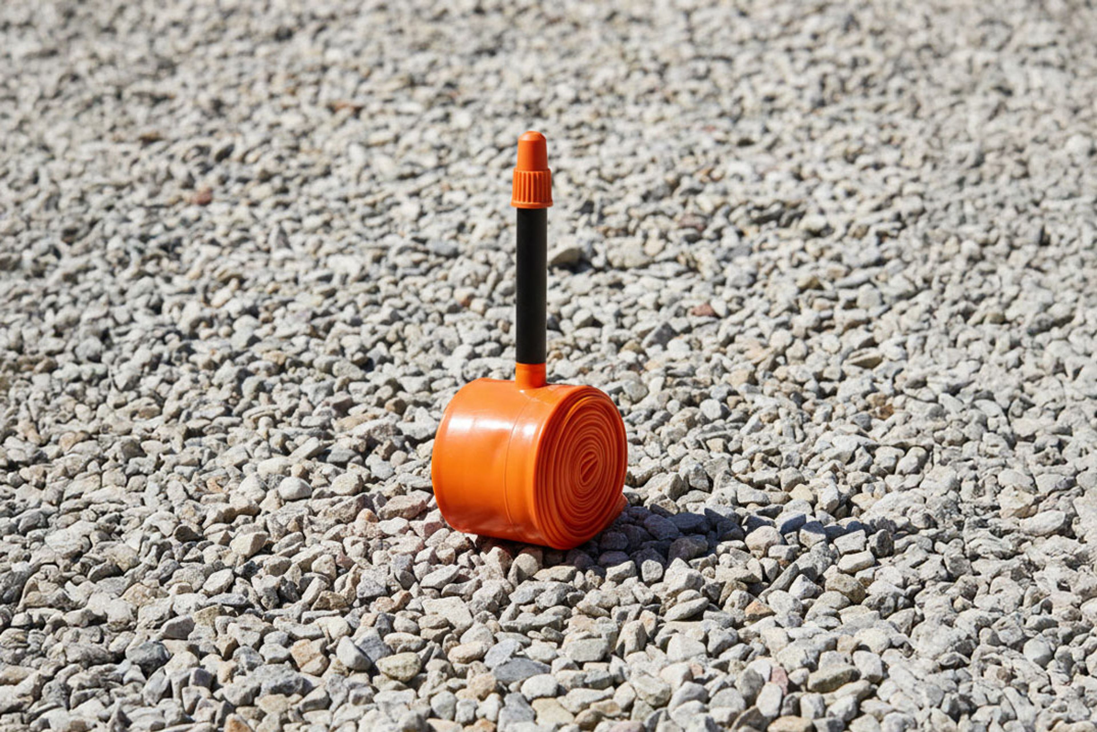 An Tubolito S-Tubo Road TPU inner tube placed on a gravel road
