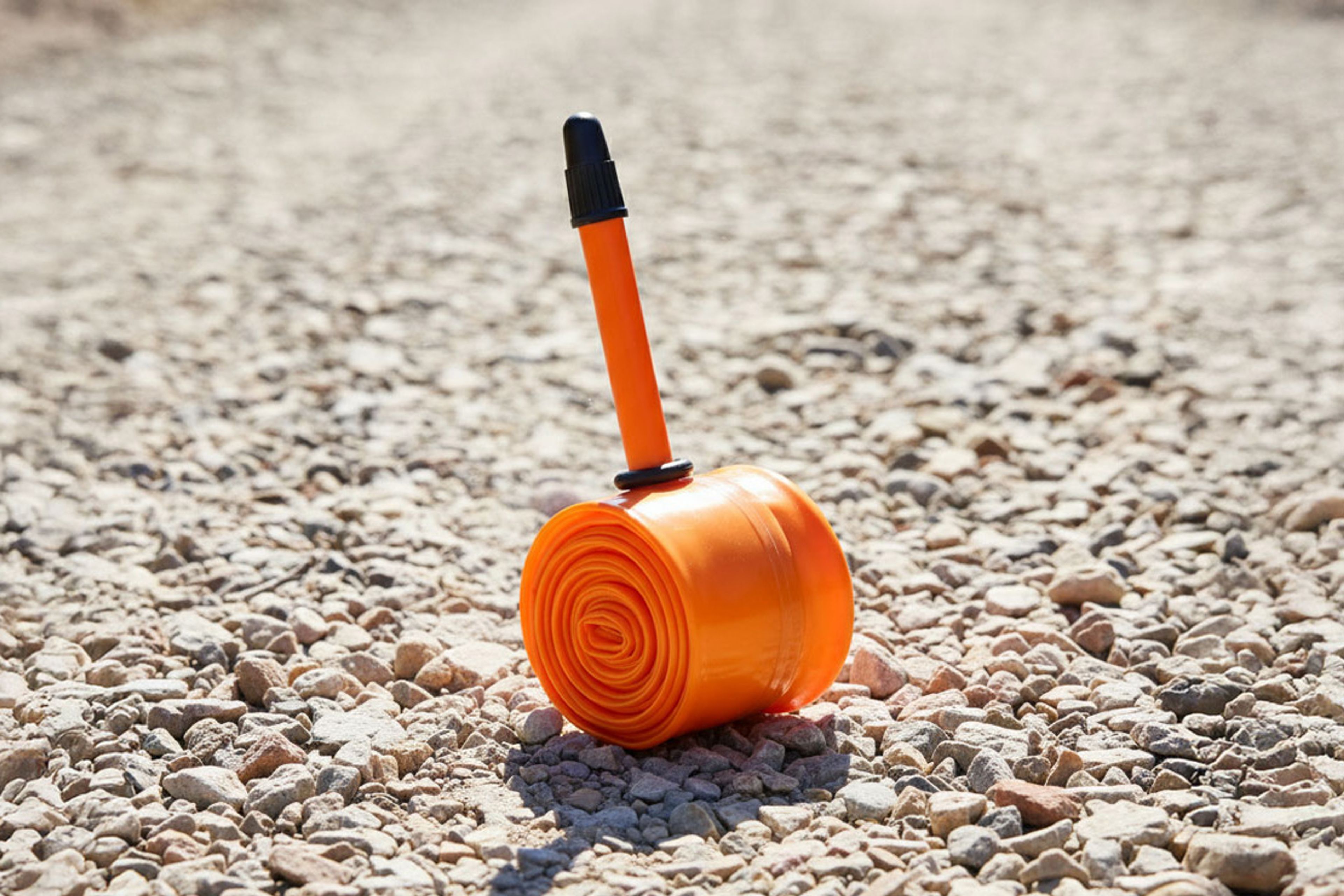 An Tubolito Tubo Road TPU inner tube placed on a gravel road