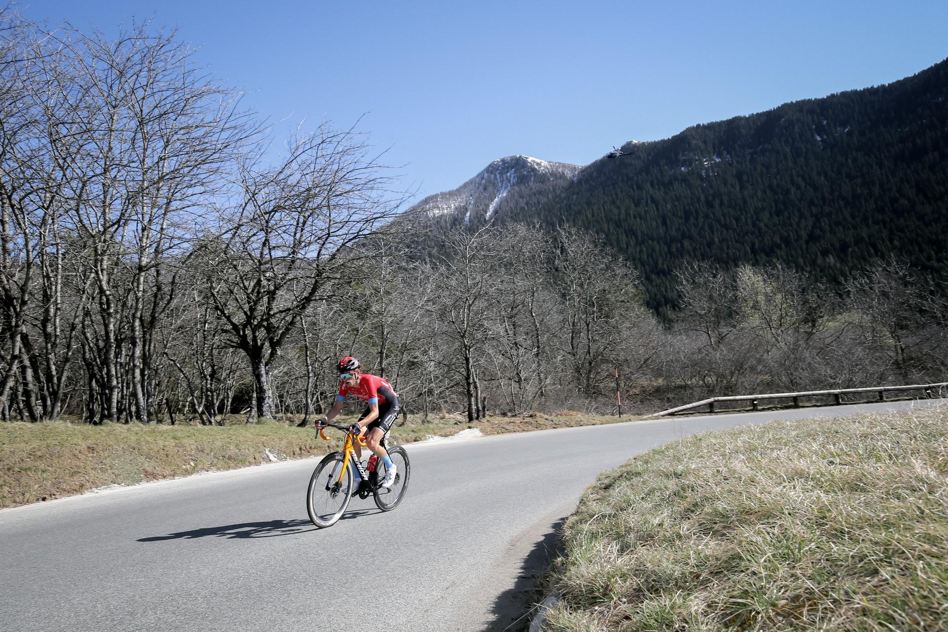 Cyclist Gino Mader attacks uphill on a road climb during Paris-Nice Etape 7 near La Colmiane