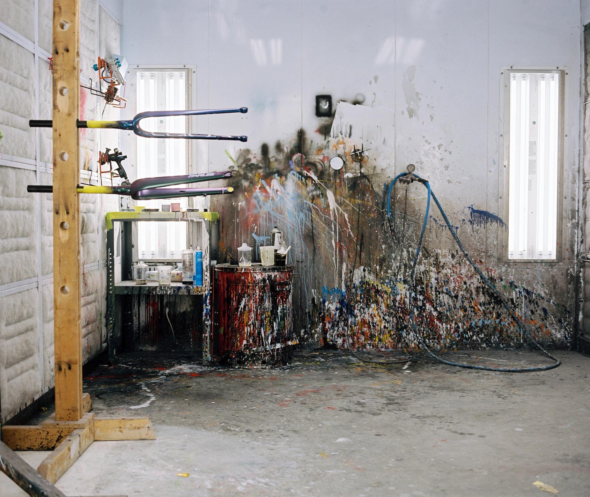 The factory floor at Parlee's Beverly headquarters, showing industrial equipment, compressed air lines, and workshop infrastructure in soft natural light.