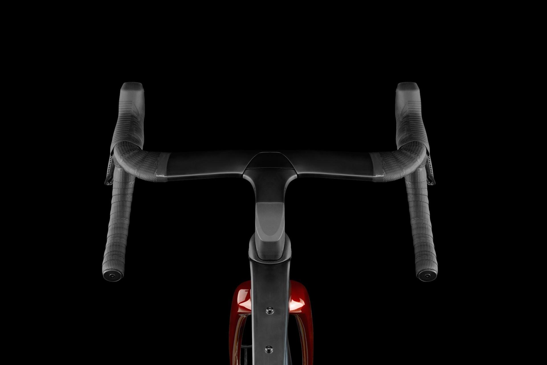 Front view of a Look Cezal RS gravel bike, showing its black drop handlebars and red frame.