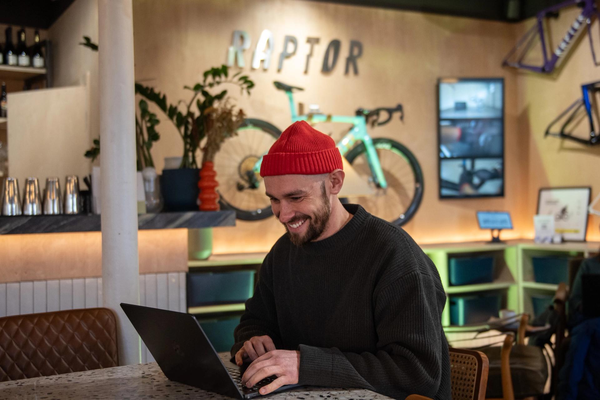 Raptor's co-founder sat in The Clubhouse cafe working on his laptop