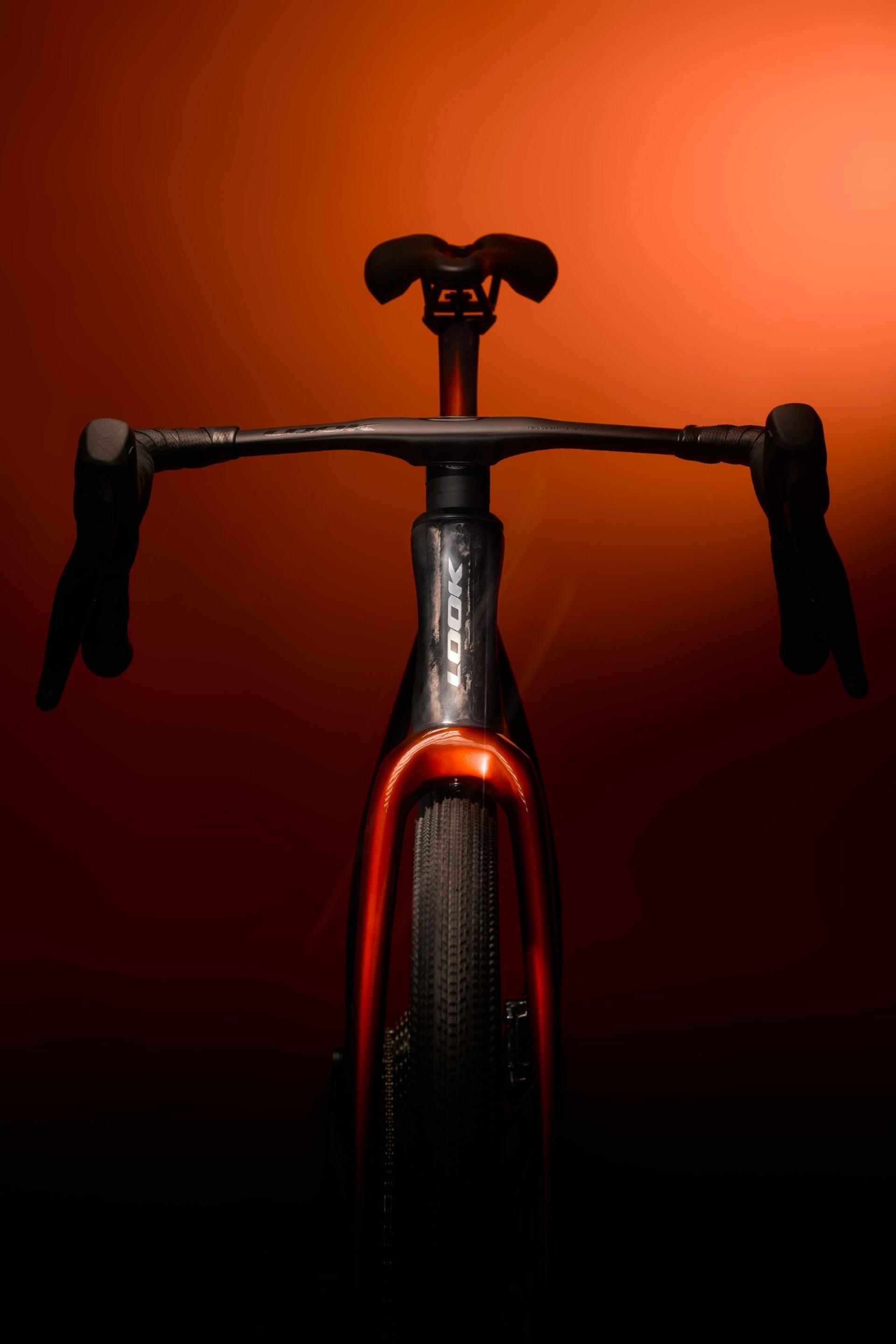 Look Cezal RS gravel bike viewed from above, with black drop bars and an orange-red frame.