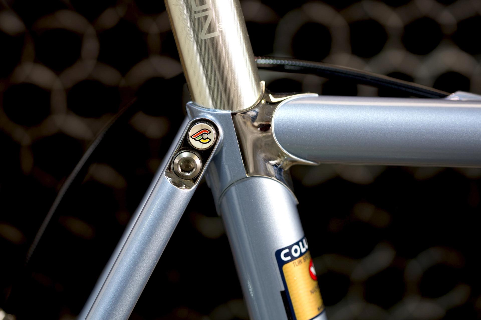 Detail view of a Cinelli Supercorsa steel frameset showing the lugged seat cluster, internal cable routing and Columbus steel tubing.