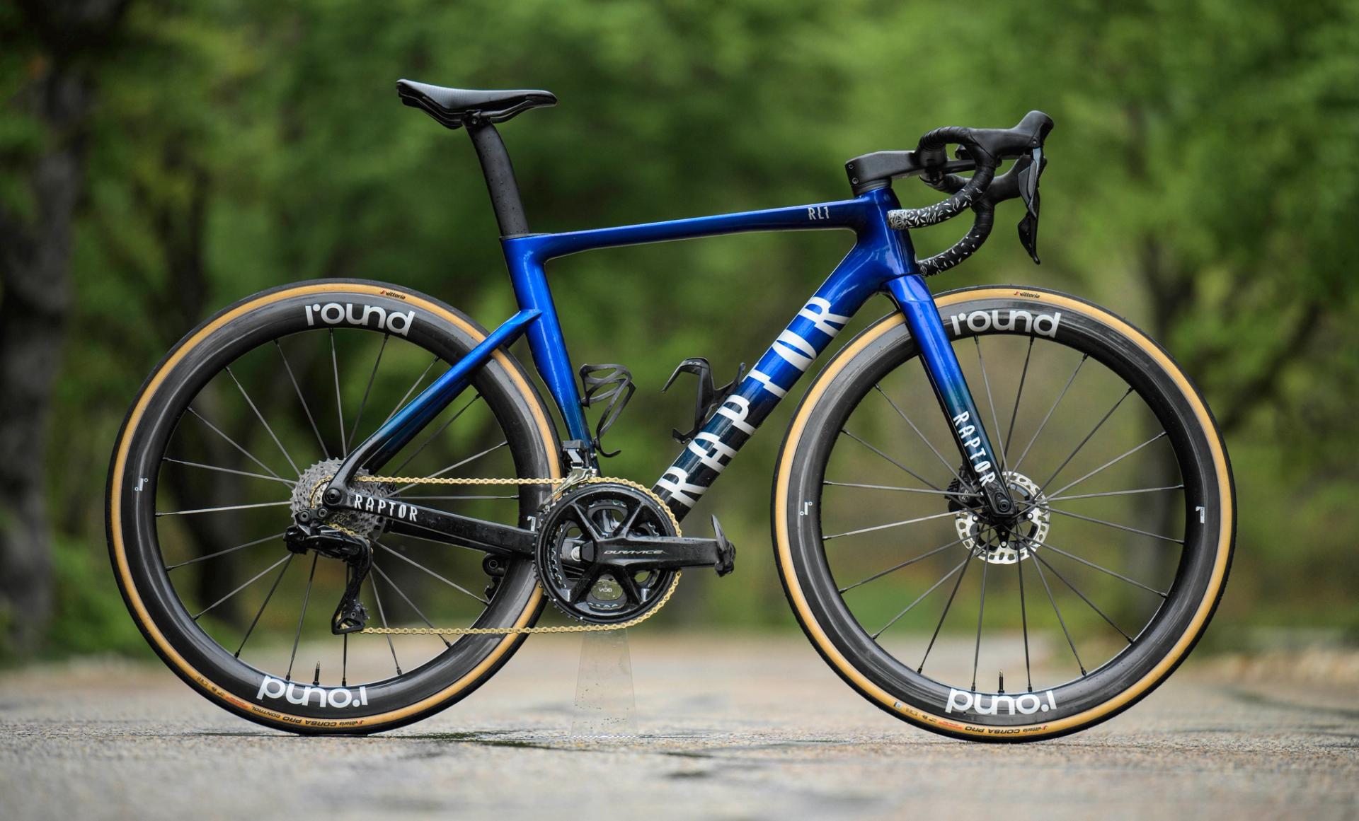 Raptor road bike side-on on a tarmac road