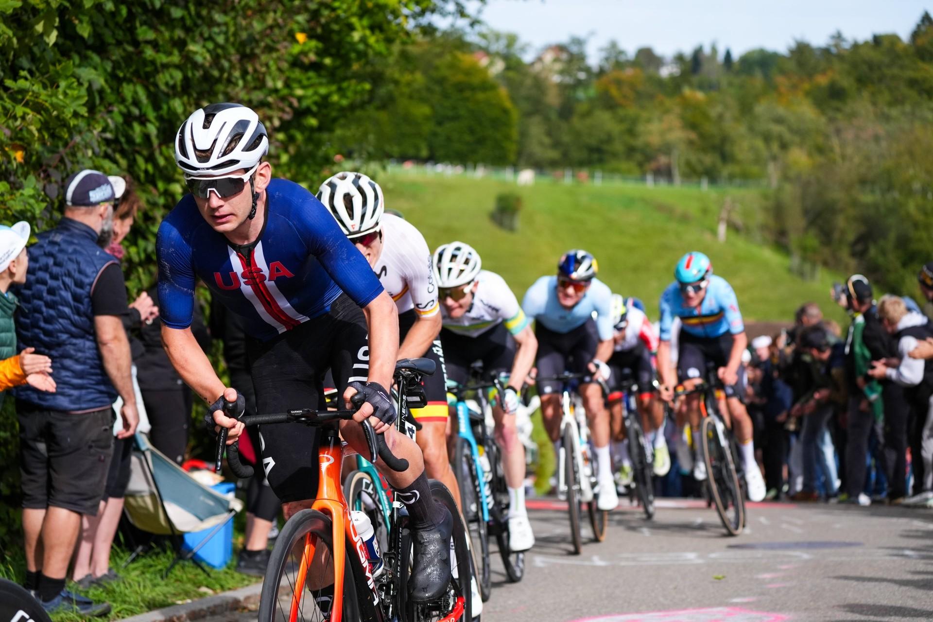 Magnus Sheffield rides at the front of a line of cyclists during a team training session.