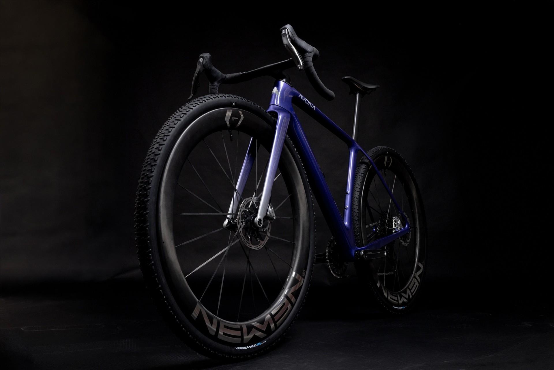 Black NEWMEN 32-inch gravel wheelset displayed on a dark background.