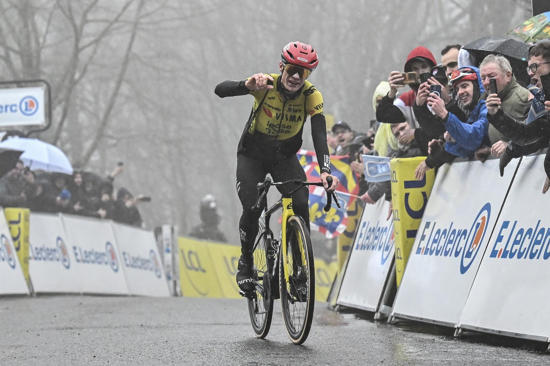 Jonas Vingegaard celebrates a solo victory for Team Visma-Lease a Bike during a foggy stage of Paris-Nice.