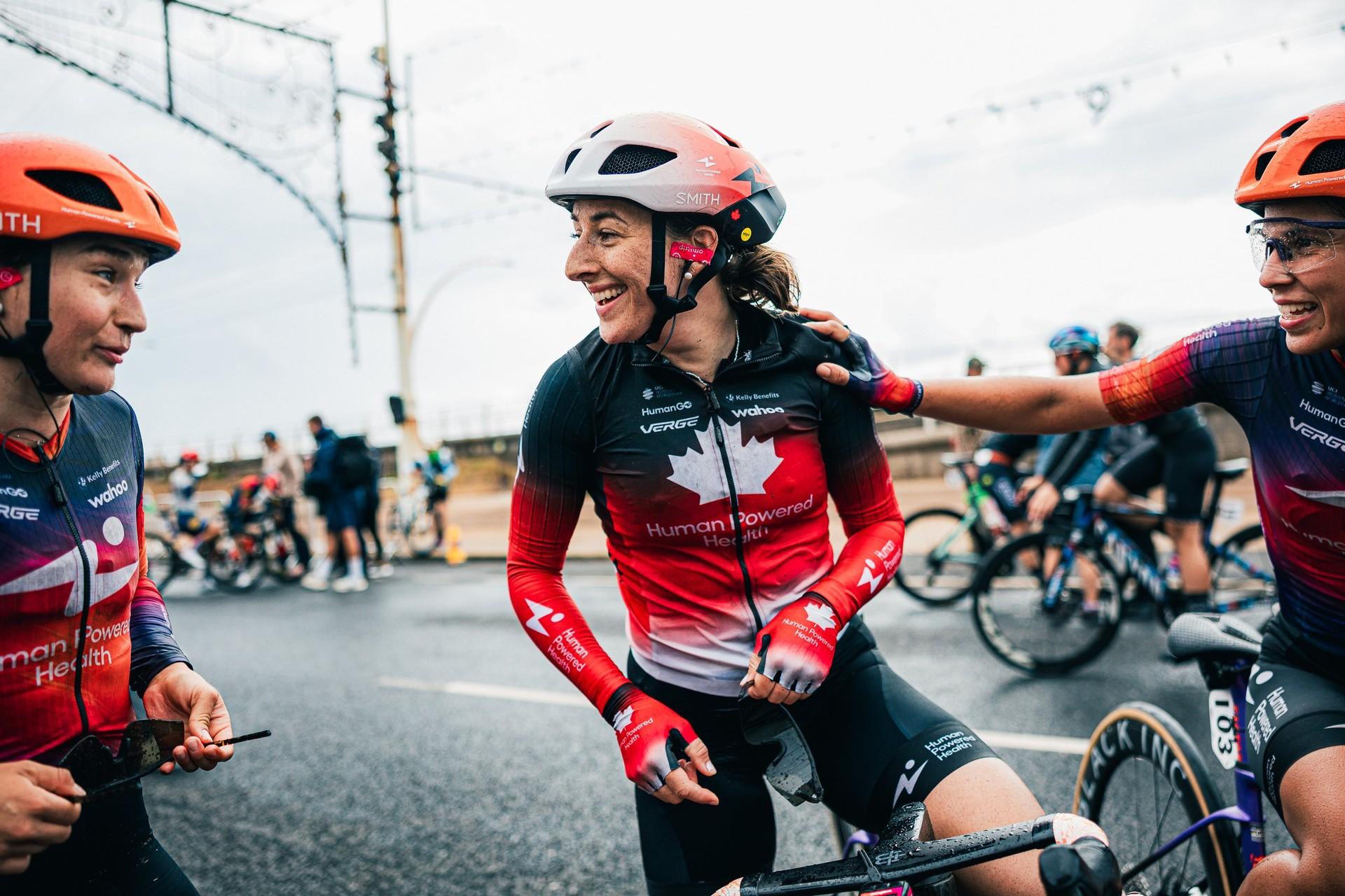 Maggie Coles-Lyster smiles while riding with Human Powered Health teammates at the Tour of Britain Women.