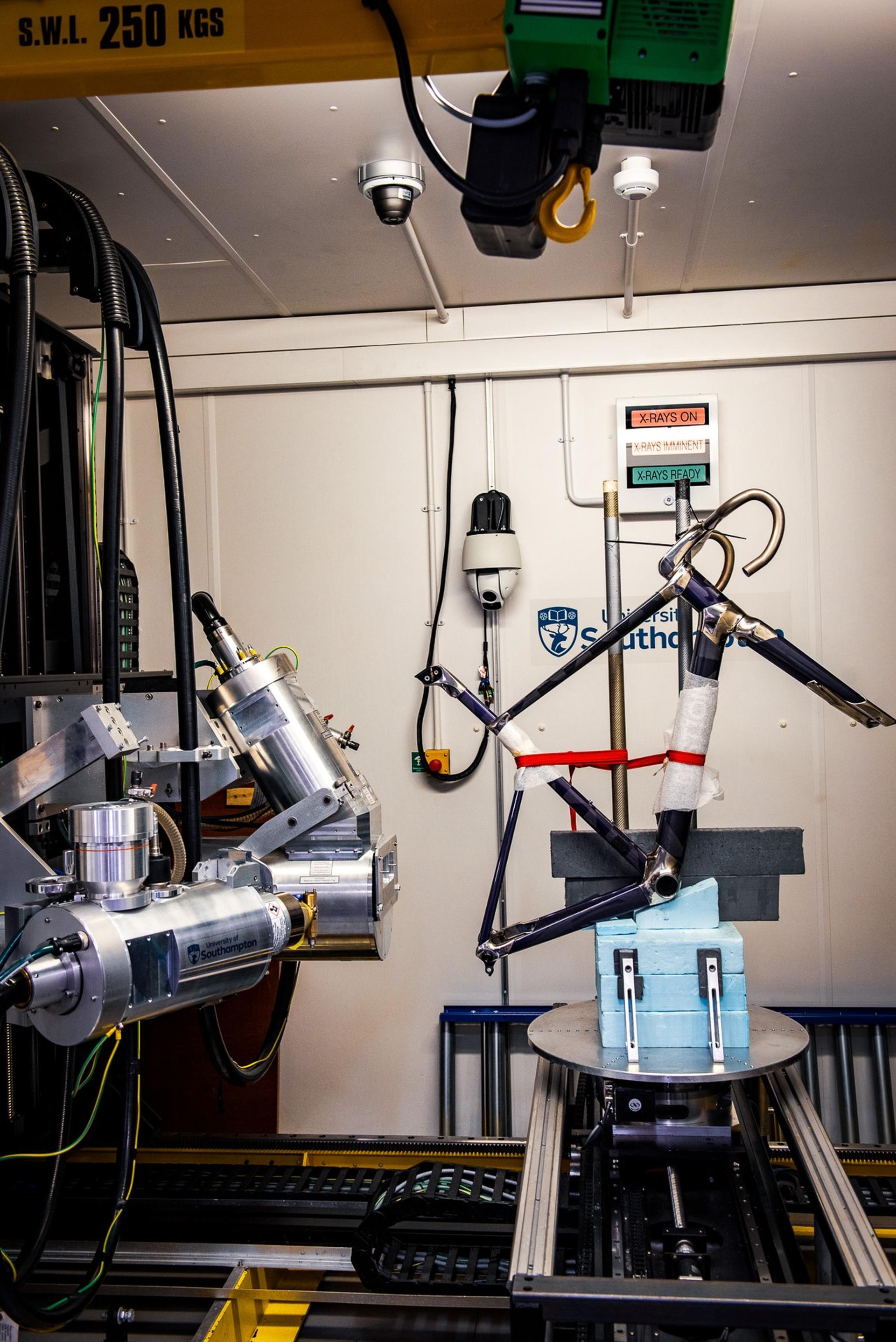 Cycling wind-tunnel rig with a bike mounted on a test platform inside a lab